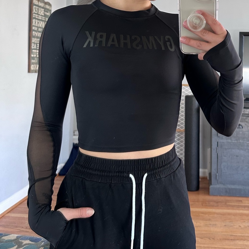 Gymshark black top with mesh arm details size XS new with tags.